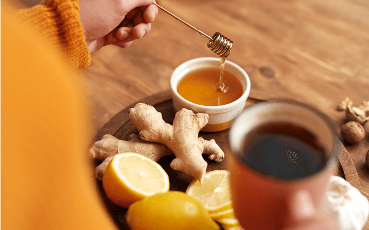 Honey, Ginger, Sliced Lemon and Tea In a Wooden Tray