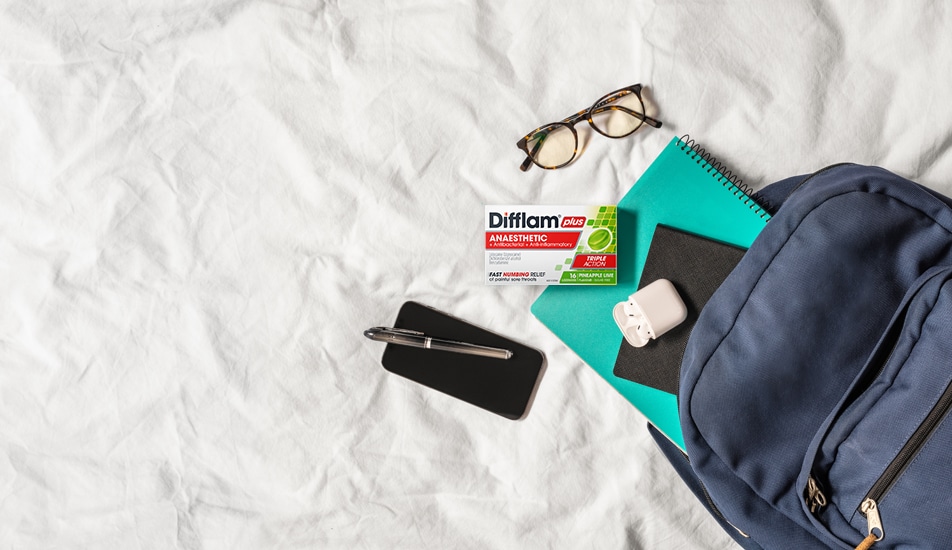 Difflam Plus Anaesthetic Sore Throat Lozenges Pineapple & Lime Flavour - Lifestyle Image Out Of Backpack